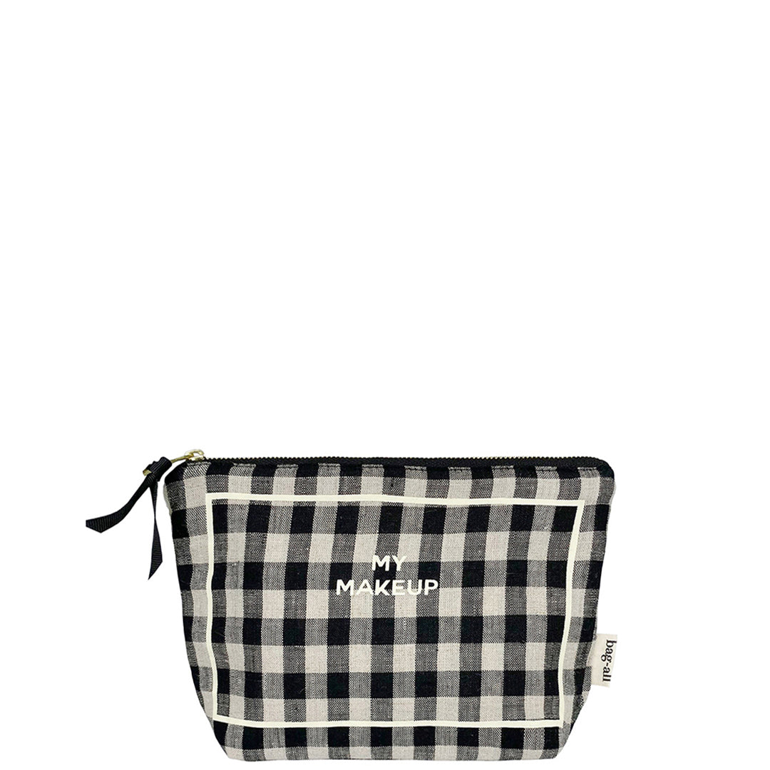 Bag-all My Makeup Pouch in black and white gingham pattern with spill-proof coated lining and gold zipper, perfect for travel cosmetics and brushes