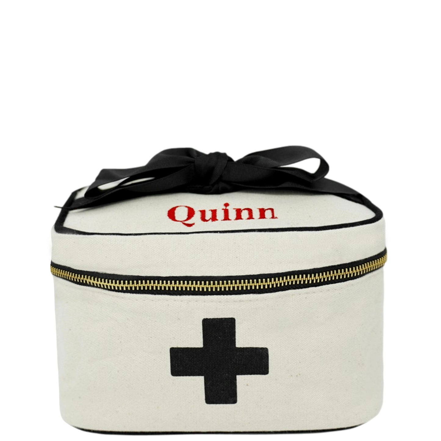 Bag-all Meds and First Aid Storage Box in cream cotton with black cross print, personalized name Quinn, black zipper, handle, and recycled bow