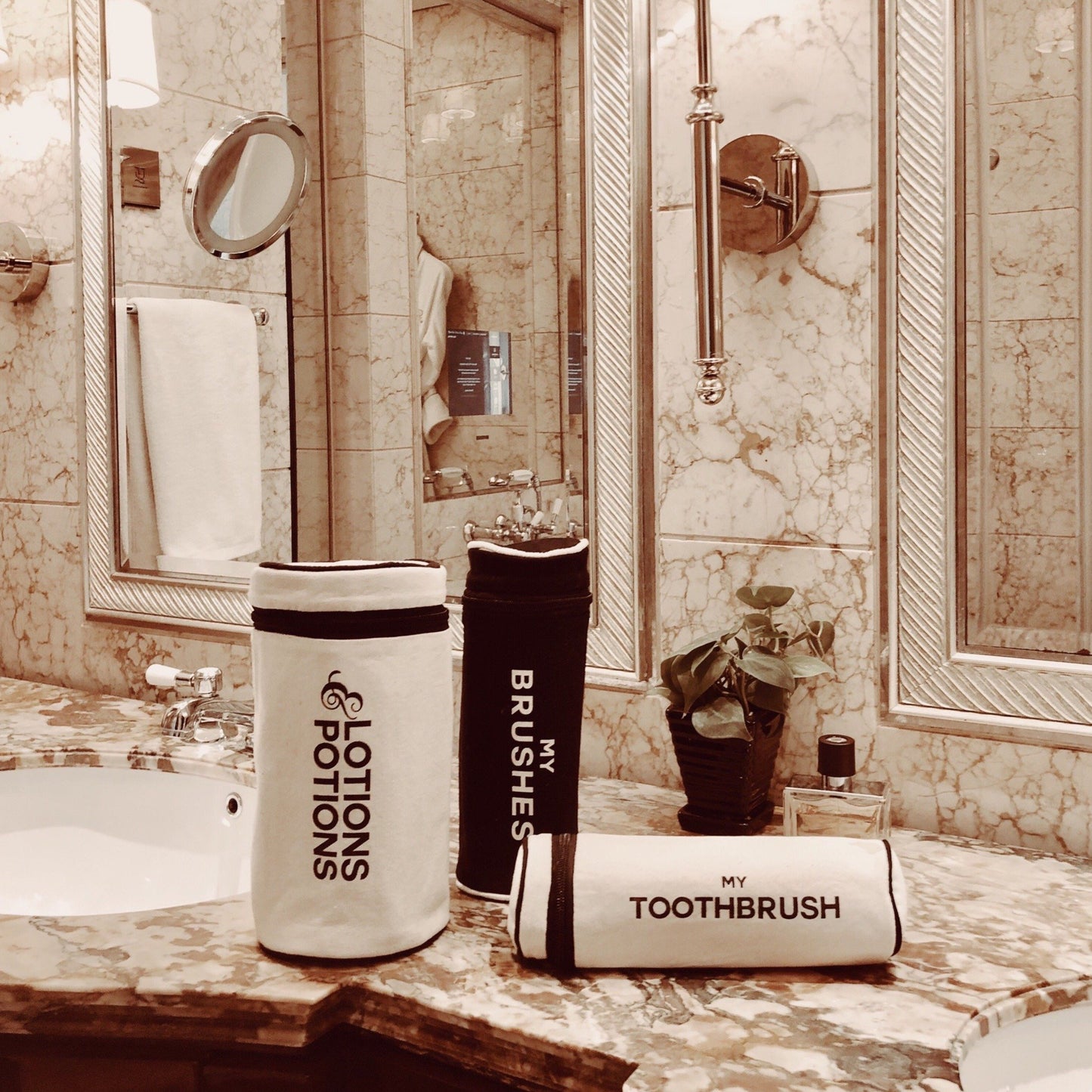 Bag-all Cream Toothbrush Travel Case displayed on marble bathroom counter with matching accessories, showcasing modern Scandinavian design and organized storage solution for oral care essentials