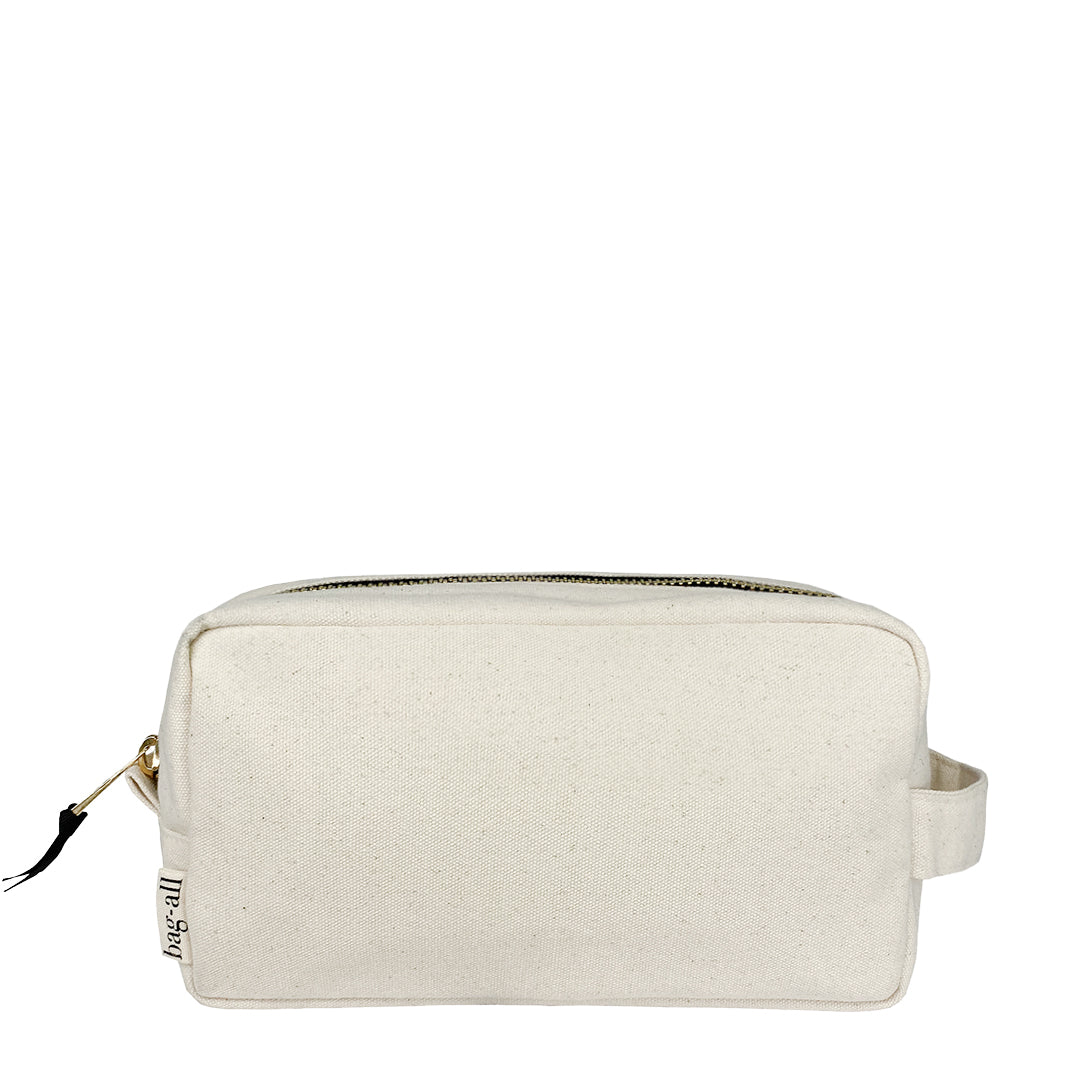 Bag-all My Skin Care Organizing Pouch in natural cotton with waterproof lining, featuring gold zipper and side handle for convenient skincare storage and travel