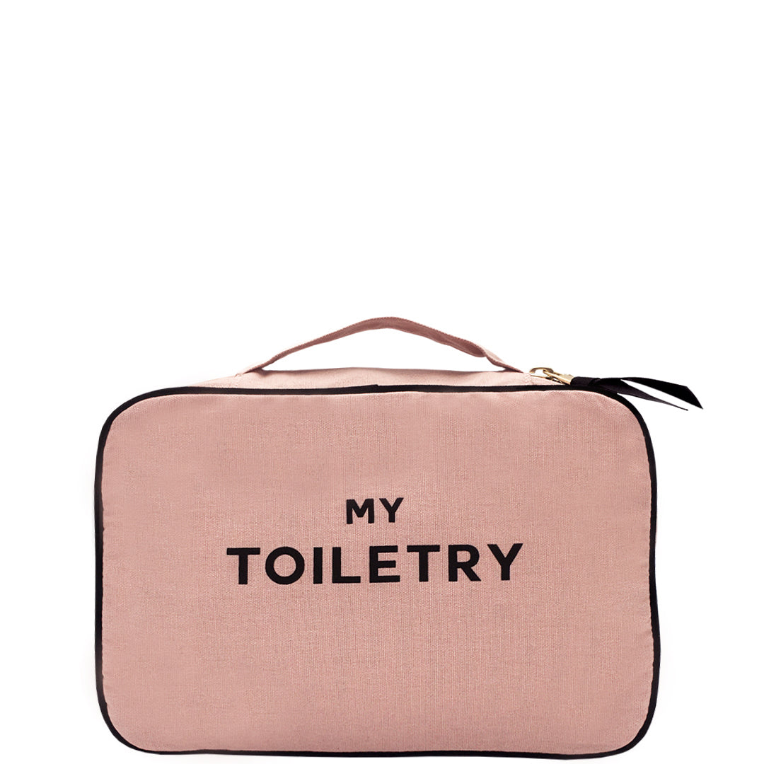 Bag-all Folding Toiletry Case in blush pink with multiple compartments, black trim, handle, and MY TOILETRY text, perfect for organized travel storage and hanging convenience