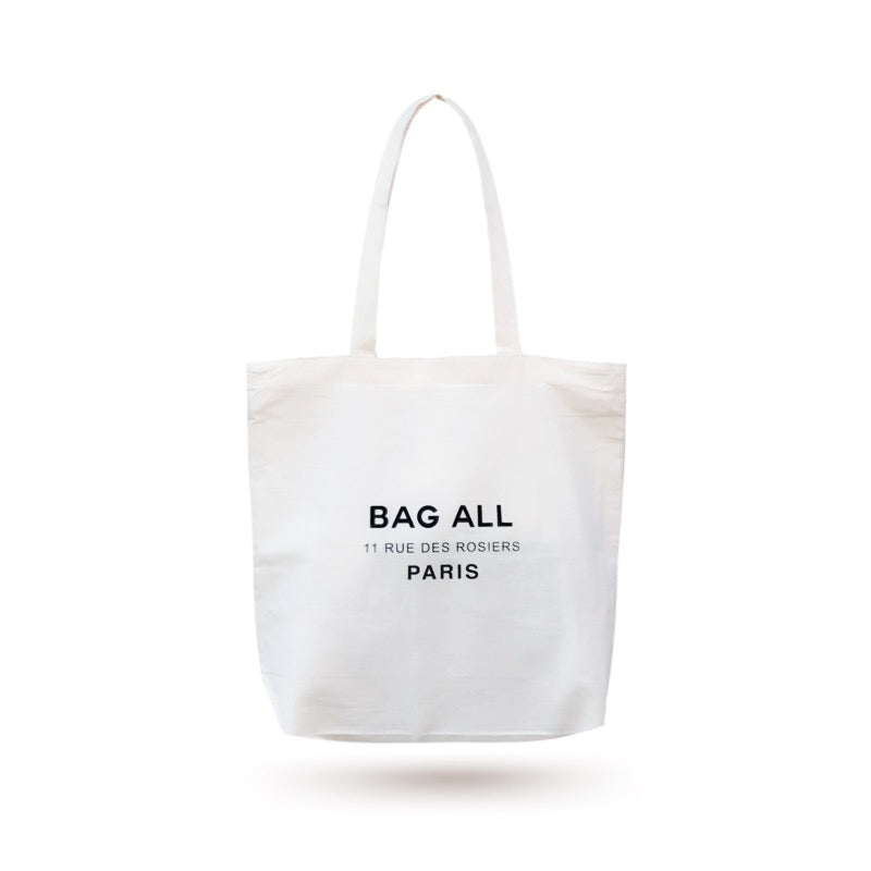 Bag-all Paris Le Marais cream cotton tote with secure zipper closure and interior pocket, featuring elegant Rue des Rosiers address print, perfect for sustainable daily essentials