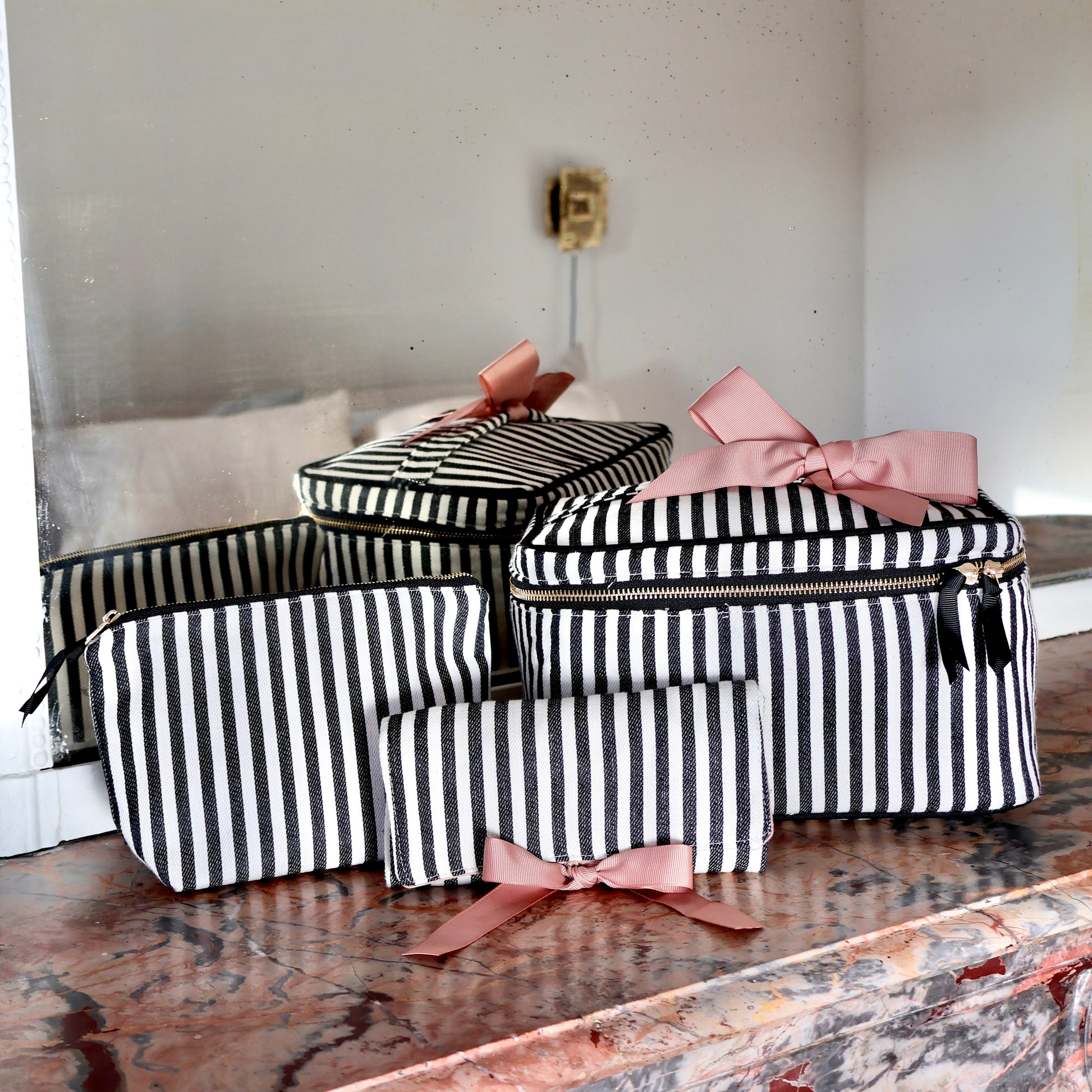 Bag-all striped 3-pack travel and makeup organizers with pink bows, stylish and functional for everyday use.