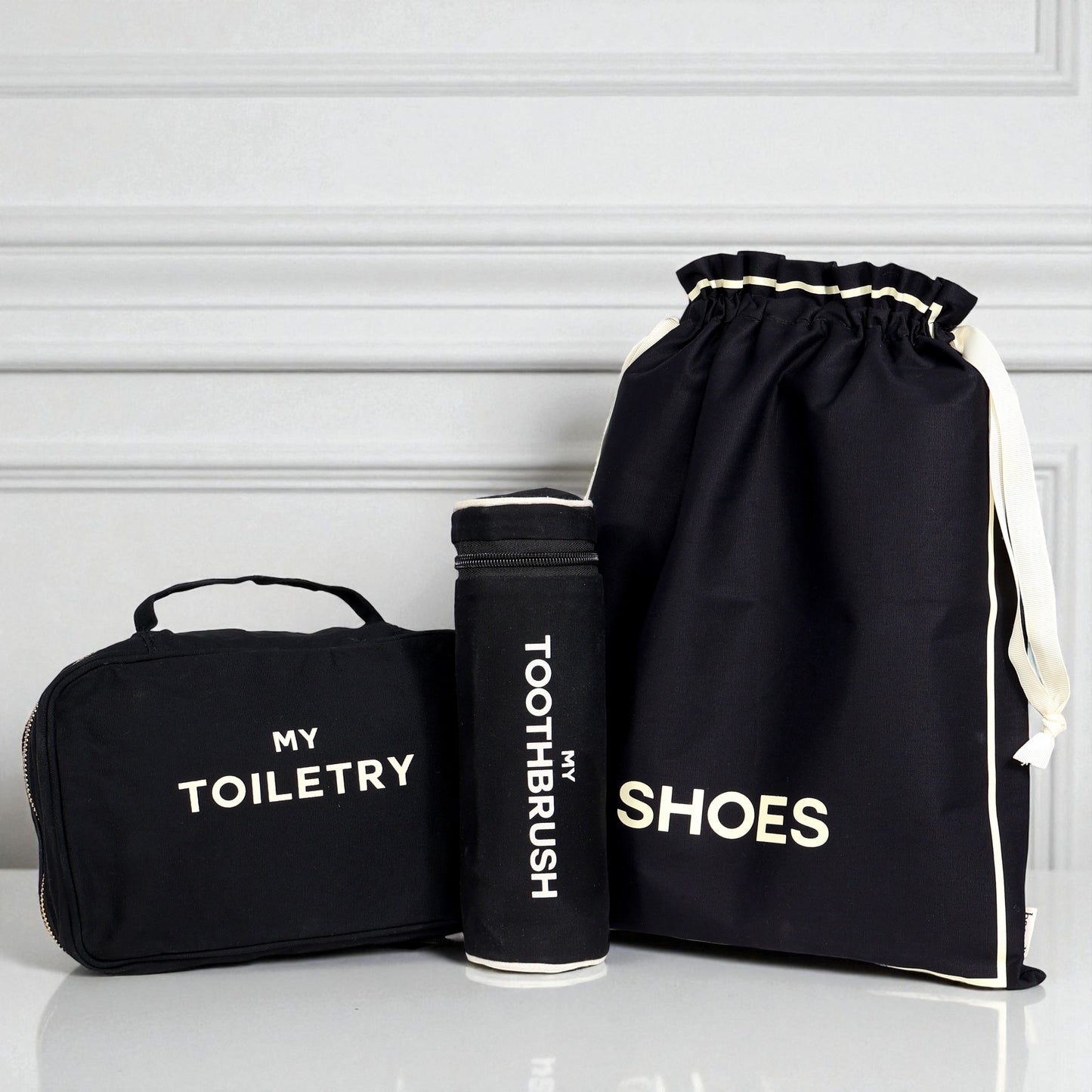 Black 3-pack packing and toiletry organizers for travel essentials by Bag-all with labeled compartments for shoes toothbrush and toiletries