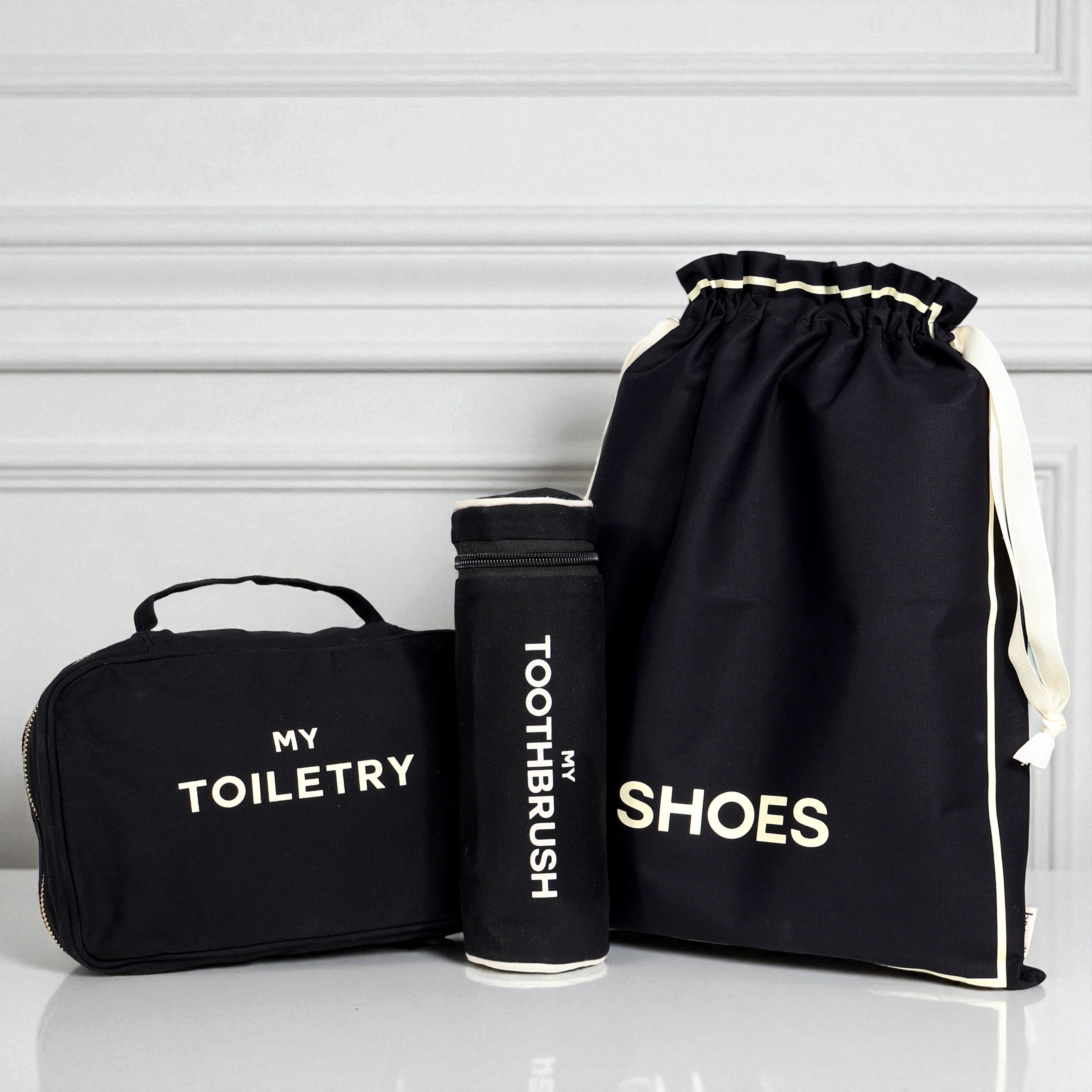 Black 3-pack packing and toiletry organizers for travel essentials by Bag-all with labeled compartments for shoes toothbrush and toiletries