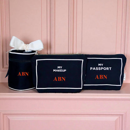 Bag-all black 3-pack travel organizers for makeup, passport, and liquids with white trim and red ABN initials