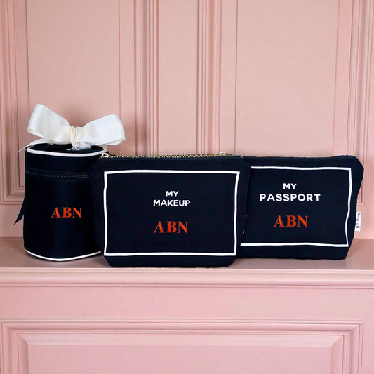 Bag-all black 3-pack travel organizers for makeup, passport, and liquids with white trim and red ABN initials