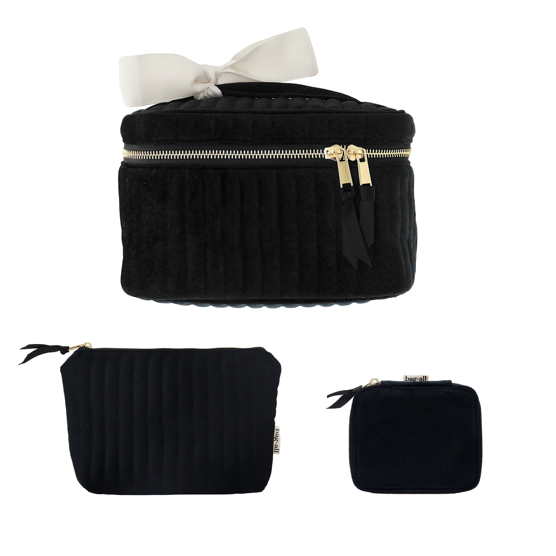 Set of three black eco velvet makeup and jewelry bags with gold zippers and white bow by Bag-all