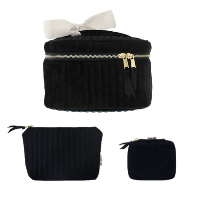 Set of three black eco velvet makeup and jewelry bags with gold zippers and white bow by Bag-all