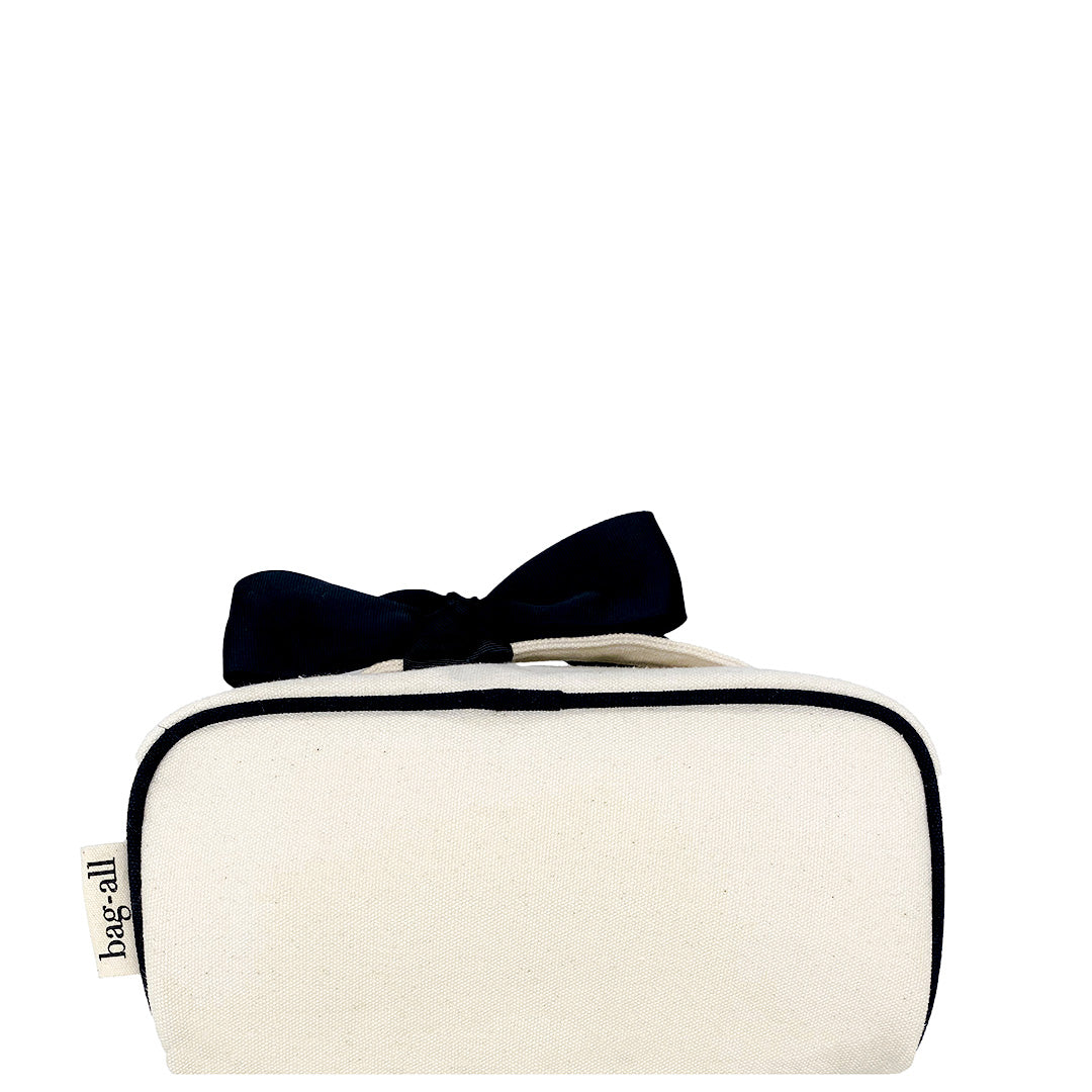 Bag-all organic cotton cosmetic case with navy bow, stylish white canvas travel makeup organizer, compact toiletry storage solution