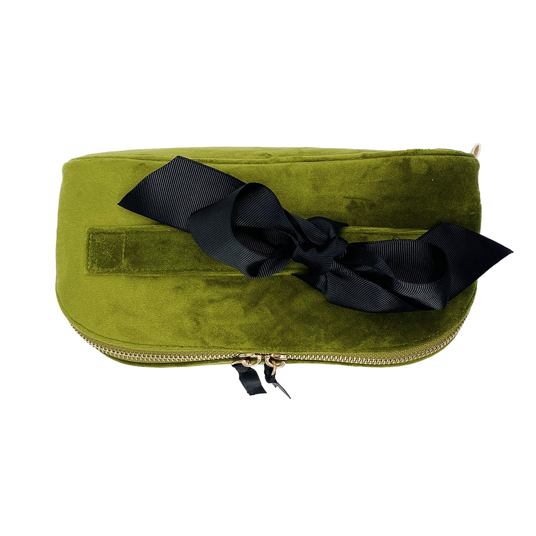 Bag-all velvet green cosmetic case with elegant black bow, featuring gold zipper detail - luxurious travel makeup organizer for stylish organization