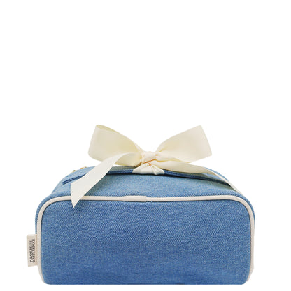 Denim expandable makeup bag with gold zipper and cream bow by Bag-all for stylish, sustainable organization