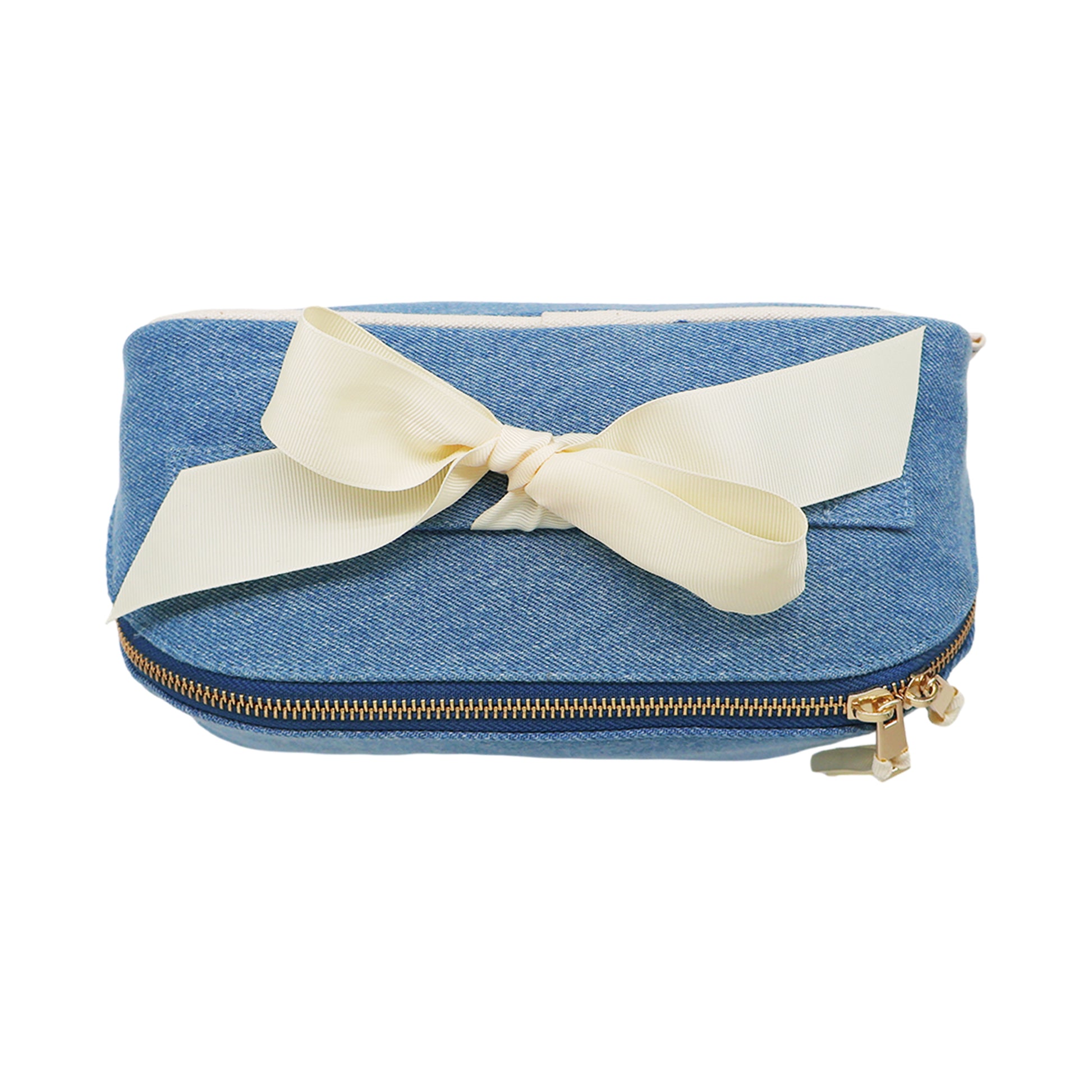 Bag-all expandable organizing makeup bag in denim with gold zipper and cream grosgrain ribbon detail for stylish storage