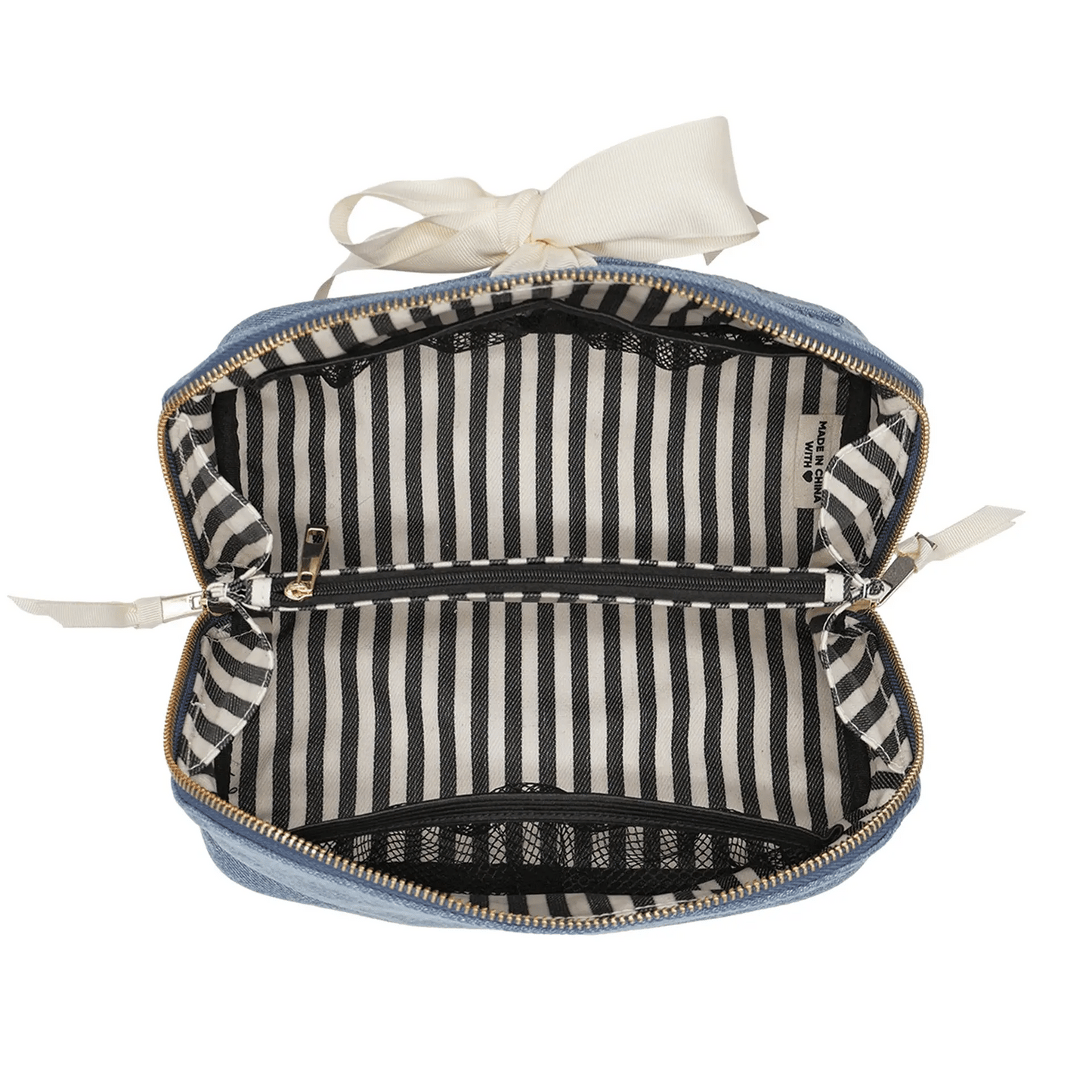Bag-all expandable denim makeup bag with striped lining, gold zipper, and durable recycled grosgrain ribbon organizer.