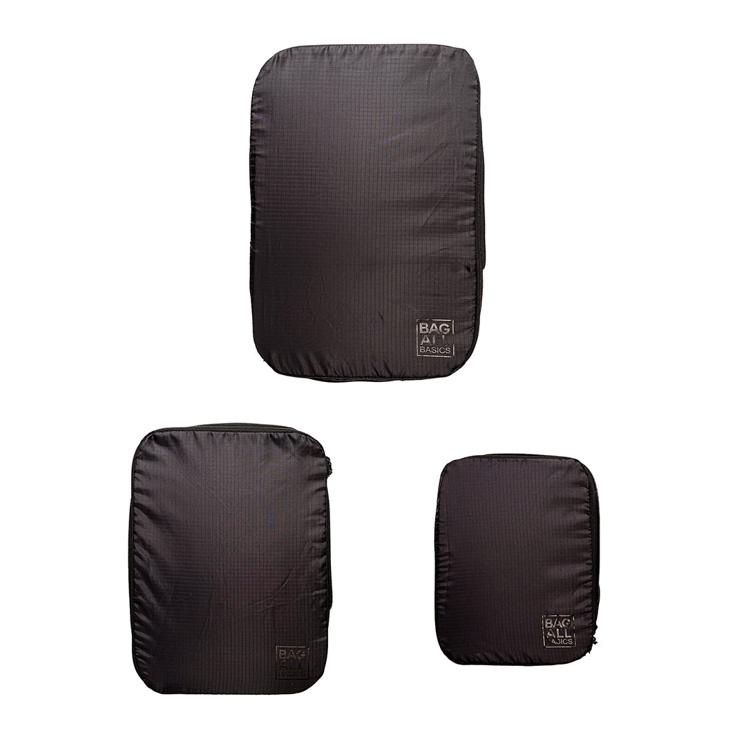 Bag-all recycled nylon compression packing cubes in black, set of 3 sizes, featuring eco-friendly construction and space-saving design for efficient travel organization