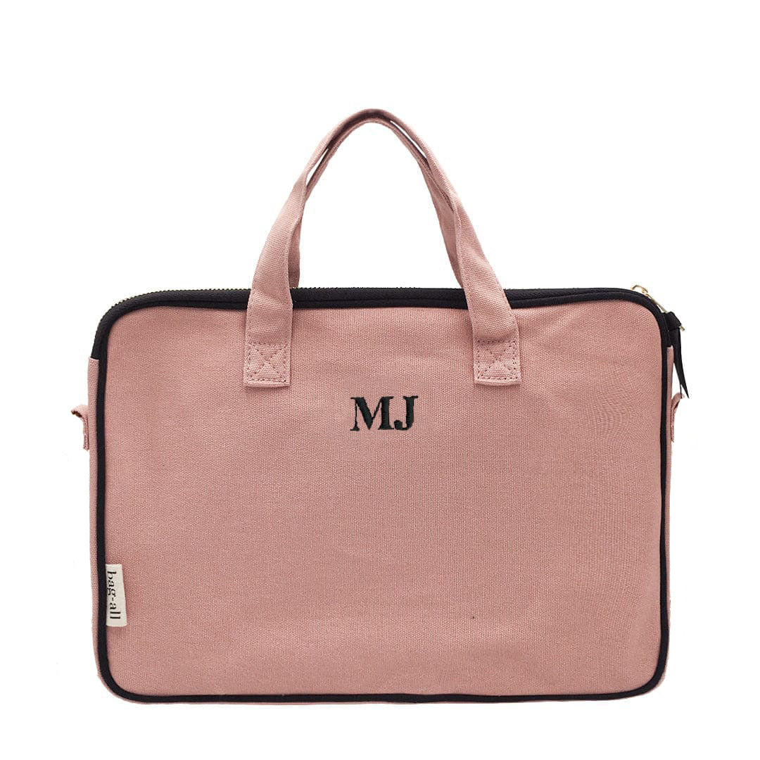 Bag-all Laptop Case 13" in blush pink cotton with charger pocket and monogram MJ. Padded sleeve with striped lining and gold hardware for 11-13" devices.