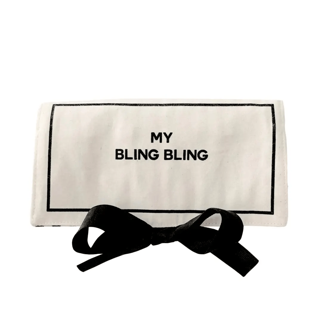 Cream Bag-all jewelry travel case with black bow tie and "My Bling Bling" print on white background
