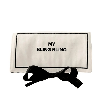 Cream Bag-all jewelry travel case with black bow tie and "My Bling Bling" print on white background
