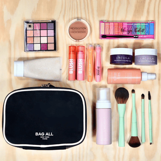 Bag-all Double Sided Toiletry Case in Black shown with grooming essentials: shaving cream, wooden comb, after-shave balm, shaving brush, and manicure tools. Waterproof cotton case with dual zippers and white trim.