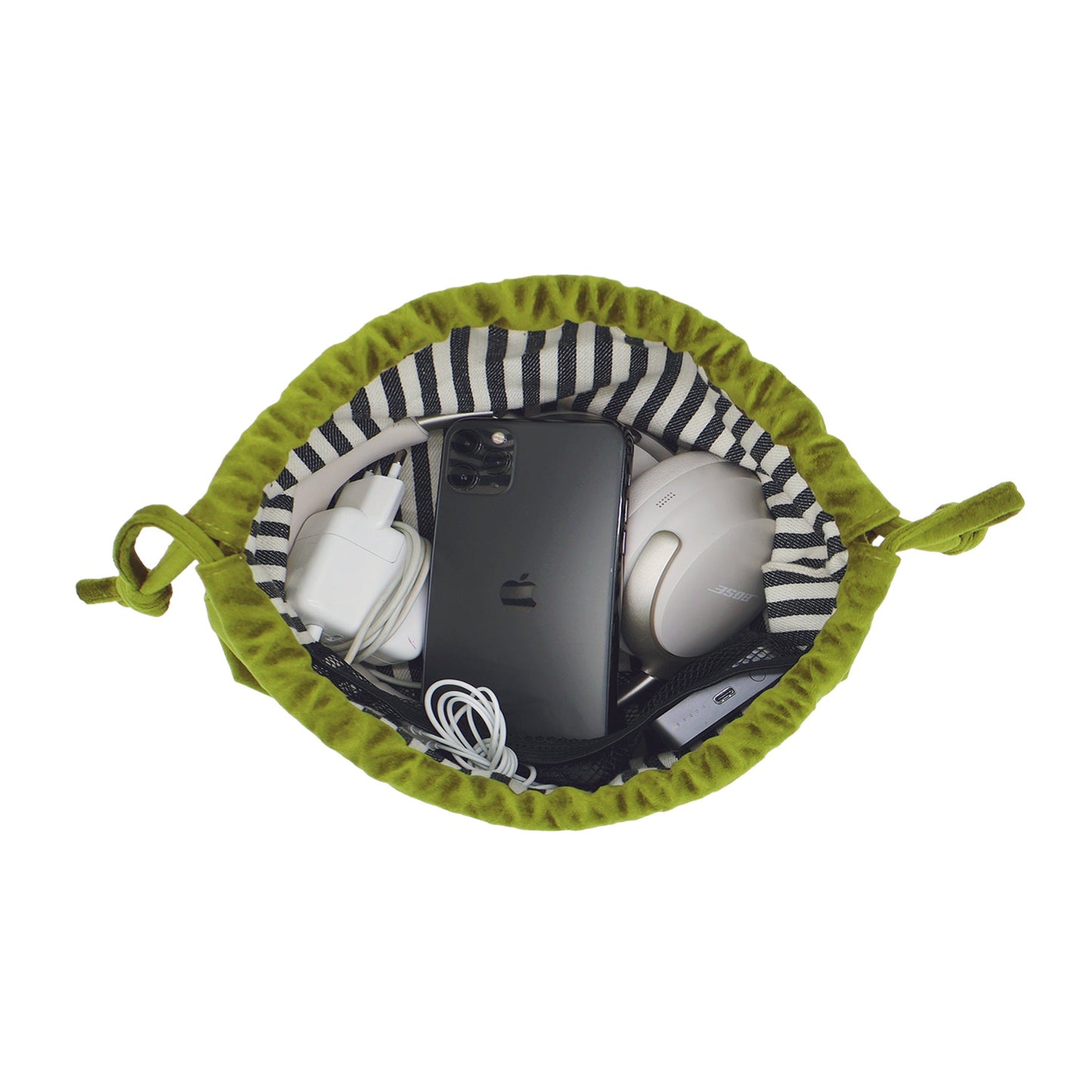 Green velvet drawstring pouch with tech essentials organized inside by Bag-all, perfect for earbuds and chargers storage