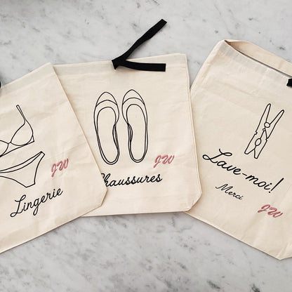 Bag-all Chaussures French Shoe Bag in cream cotton with black ribbon tie, featuring elegant line drawing of ballet flats and French text, part of organizing bags collection