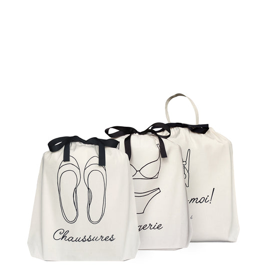 Bag-all French Collection Travel 3-pack in cream cotton featuring French text and line drawings for shoes, lingerie, and moi organizing bags with black ribbon ties