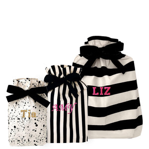 Bag-all Gift Bags Set Mix 2 featuring three reusable fabric bags with black and white patterns - splatter print and stripes, personalized with custom monograms, perfect for sustainable gift wrapping