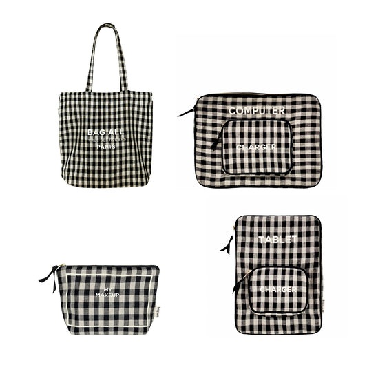 Bag-all Gingham Packing Set featuring black and white checkered laptop case, makeup pouch, zipper tote, and tablet case in coordinating pattern with embroidered labels