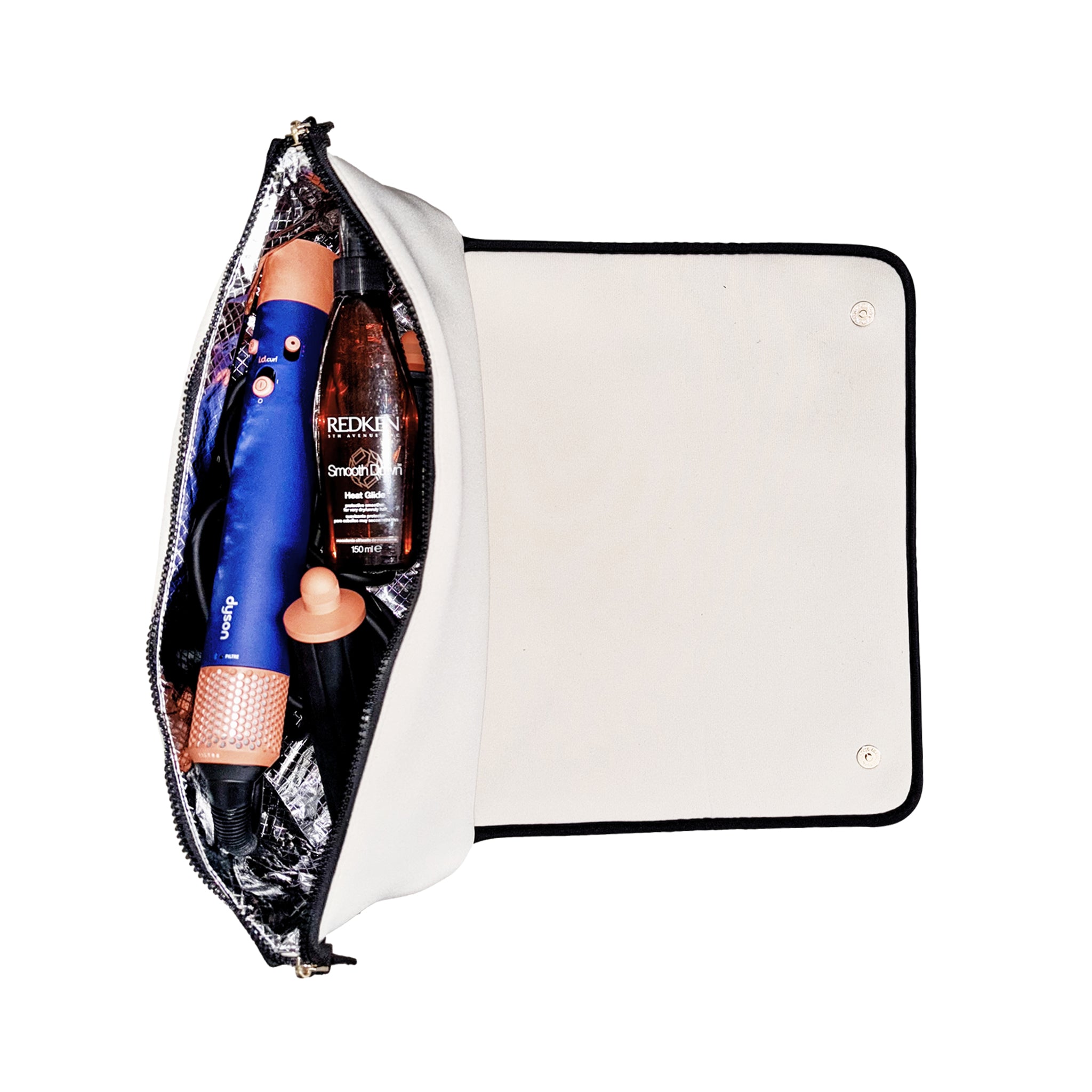 Bag-all cream hair tools travel case with heat-resistant mat holding styling tools and hair products interior view