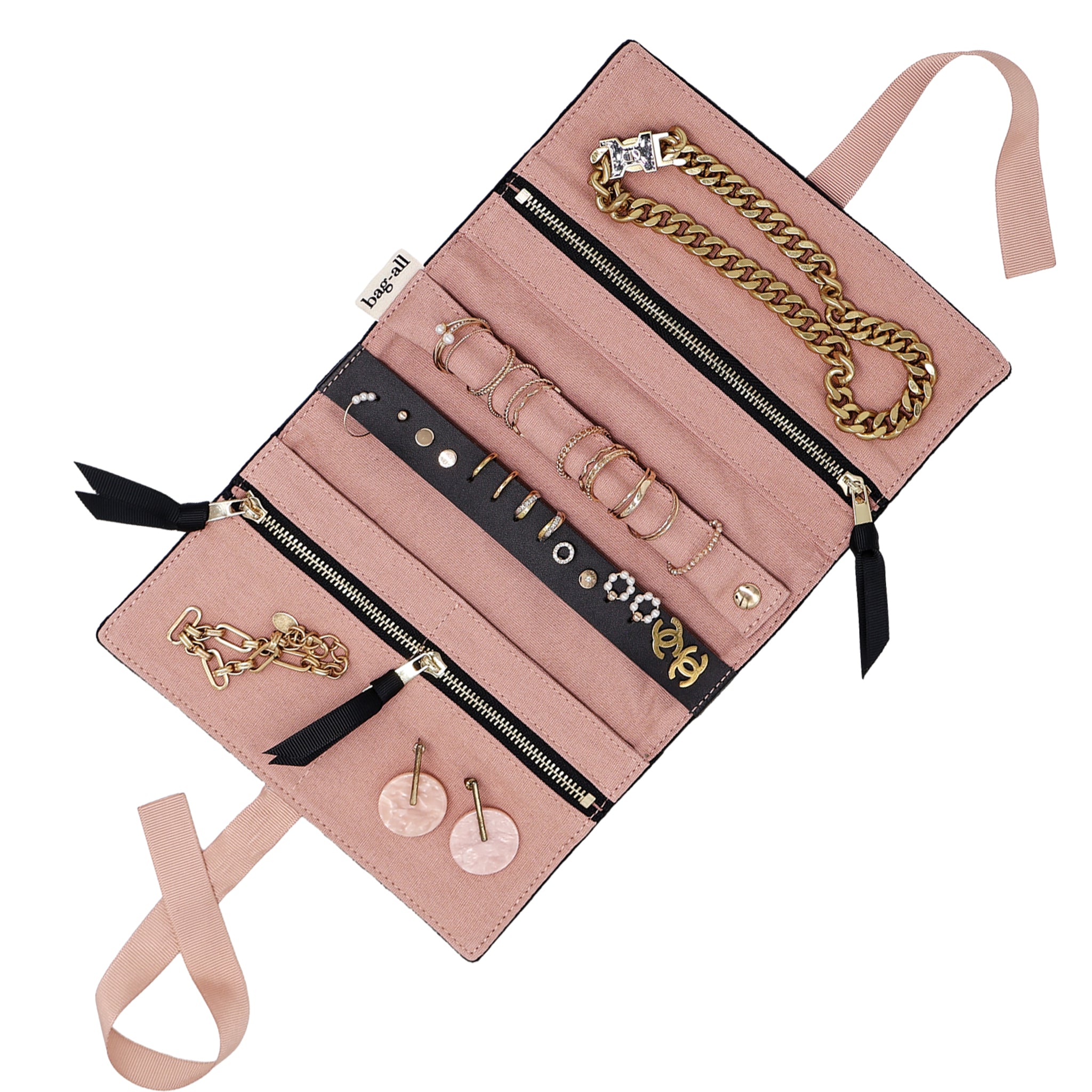 Bag-all eco velvet jewelry roll in black with pink interior, zipper compartments, and leather earring holder for travel organization