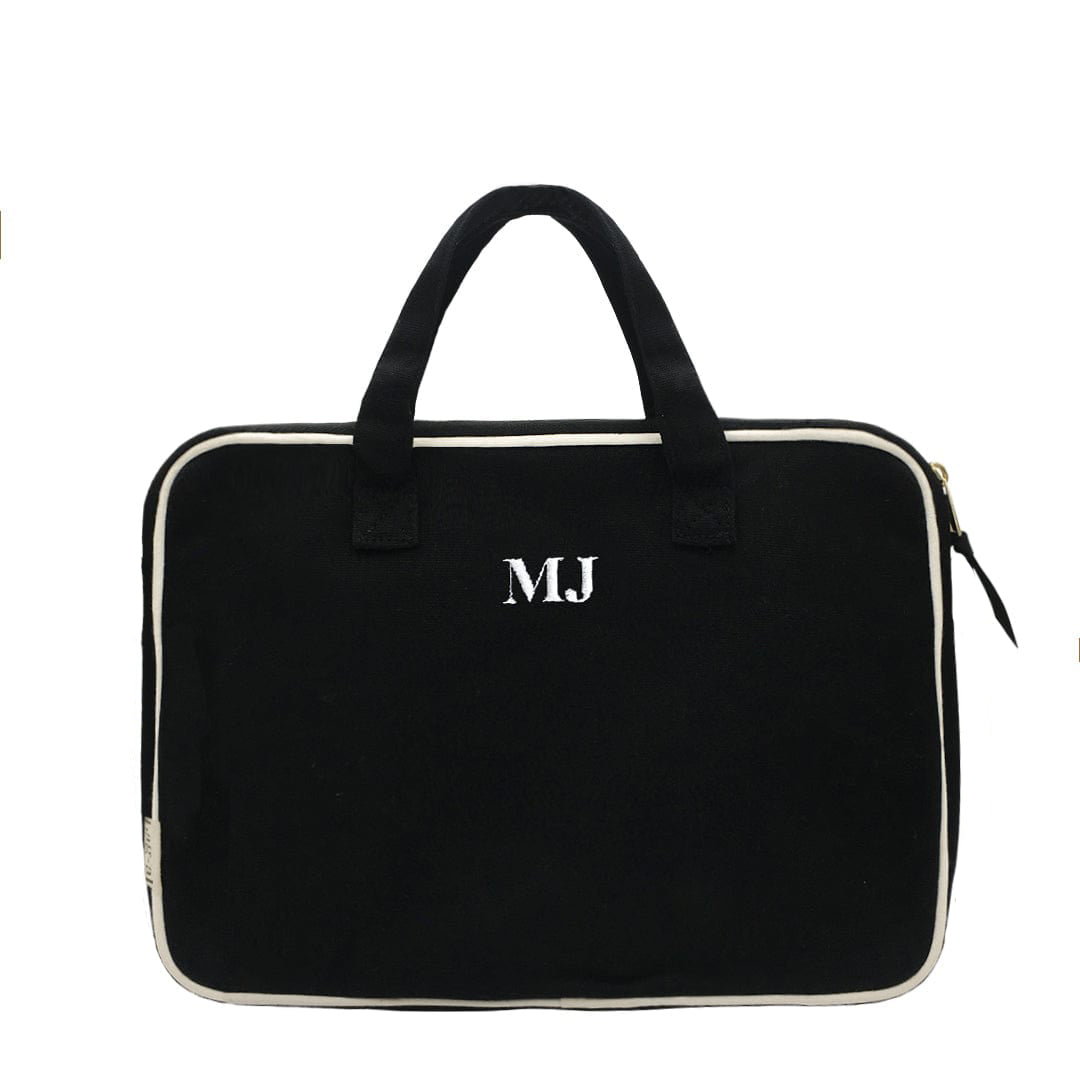 Bag-all Black Laptop Case 13" with handle and charger pocket, featuring monogram detail, white trim, padded protection and dual carrying options - perfect for modern professionals