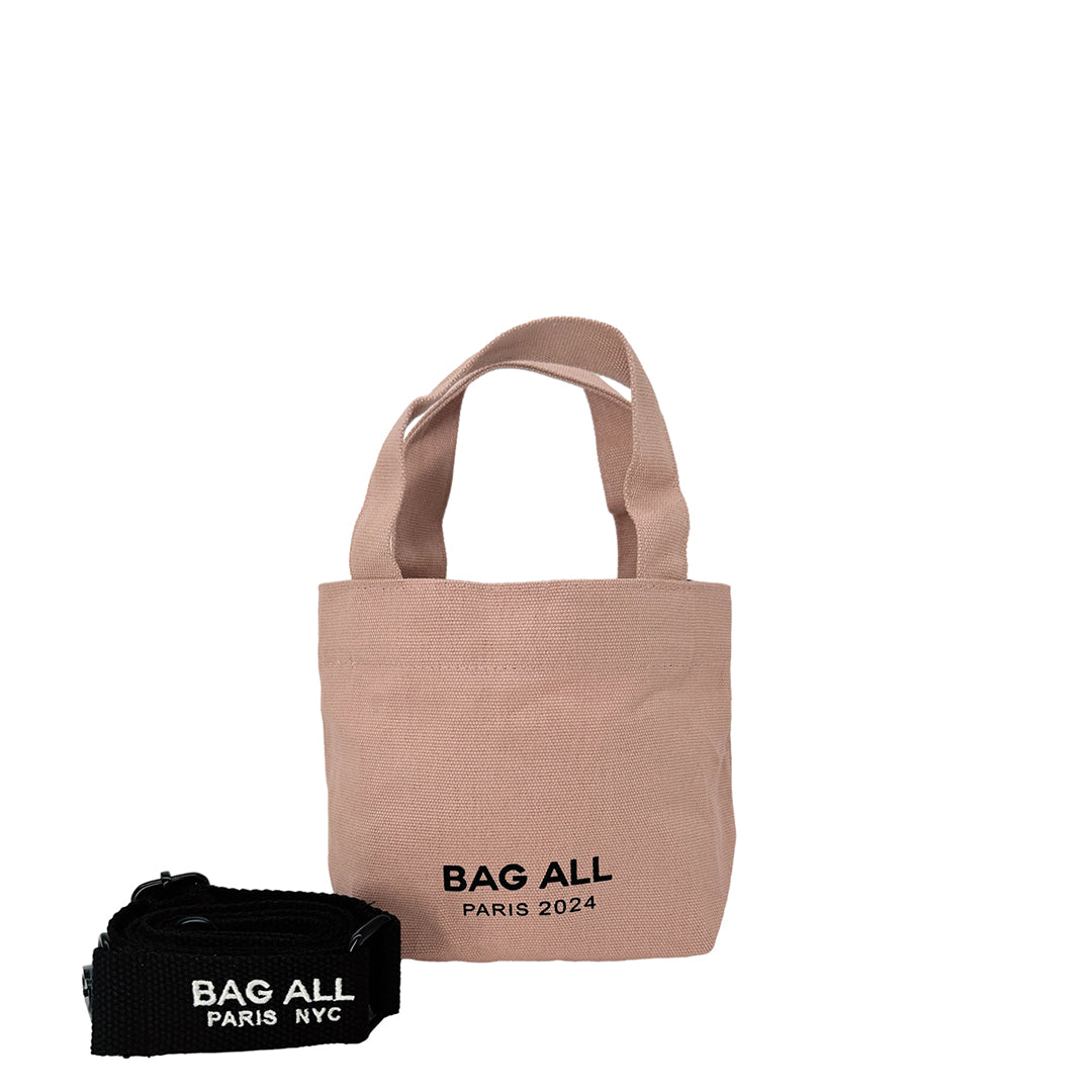 Bag-all Mini Tote Bag in pink/blush cotton with adjustable black strap, interior pocket, and branded Paris NYC logo, perfect for everyday sustainable style
