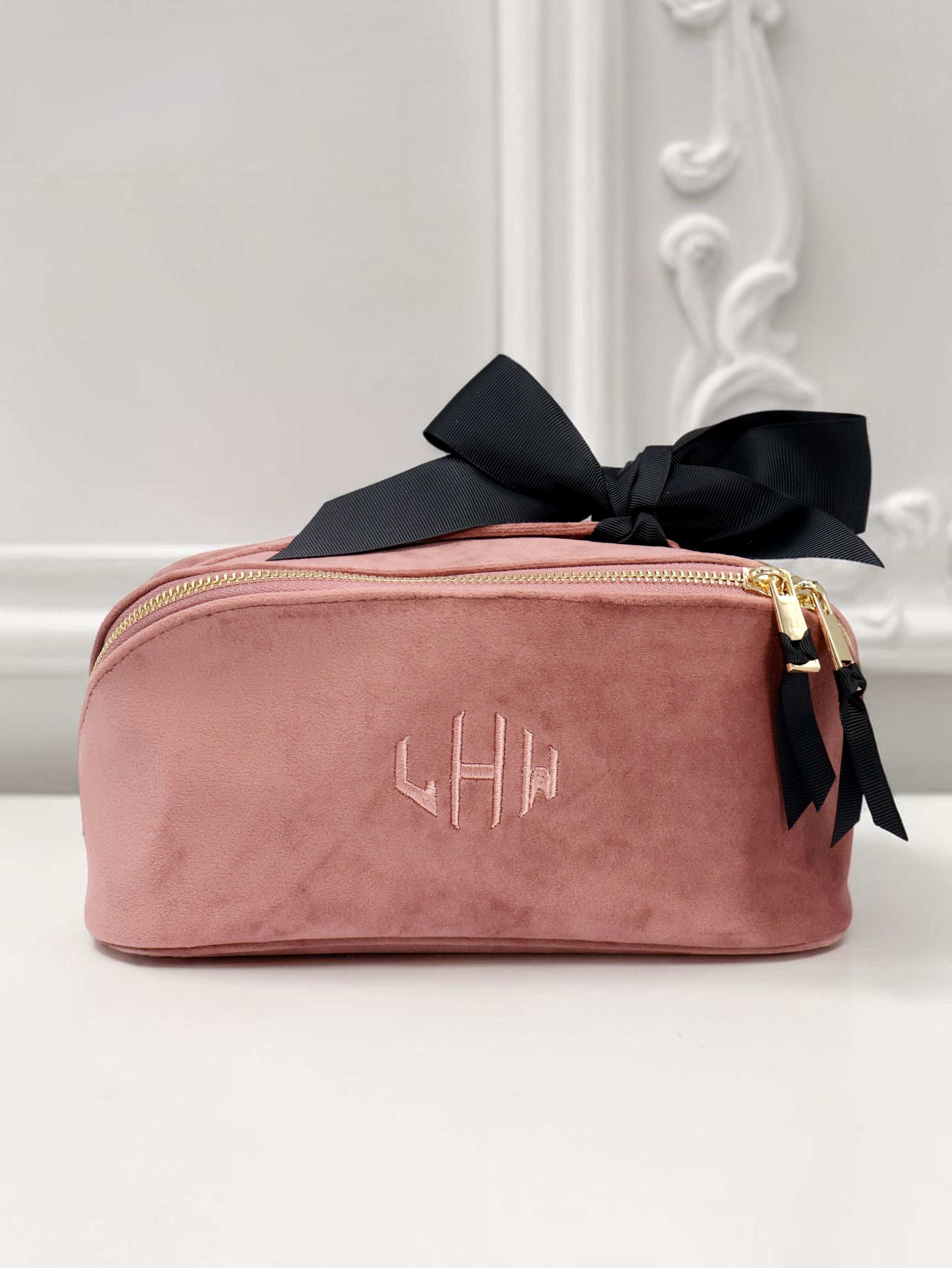 Pink velvet travel pouch with gold zipper, personalized monogram, and black ribbon details for chic cotton bag organization by Bag-all Paris design.
