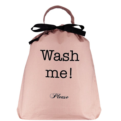 Pink blush laundry organizer bag with black ribbon and Wash me please text by Bag-all