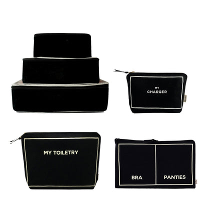 Bag-all Weekend Essential Packing Set 4-Pack in black with labeled pouches for organized travel and style