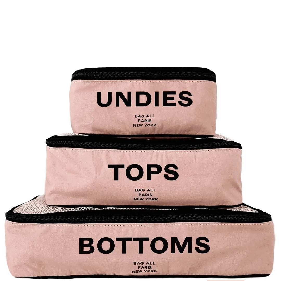 Bag-all Cotton Packing Cubes in Pink/Blush, set of 3 sizes with mesh top panels for visibility, featuring Undies, Tops and Bottom text labels, perfect for organized travel and storage
