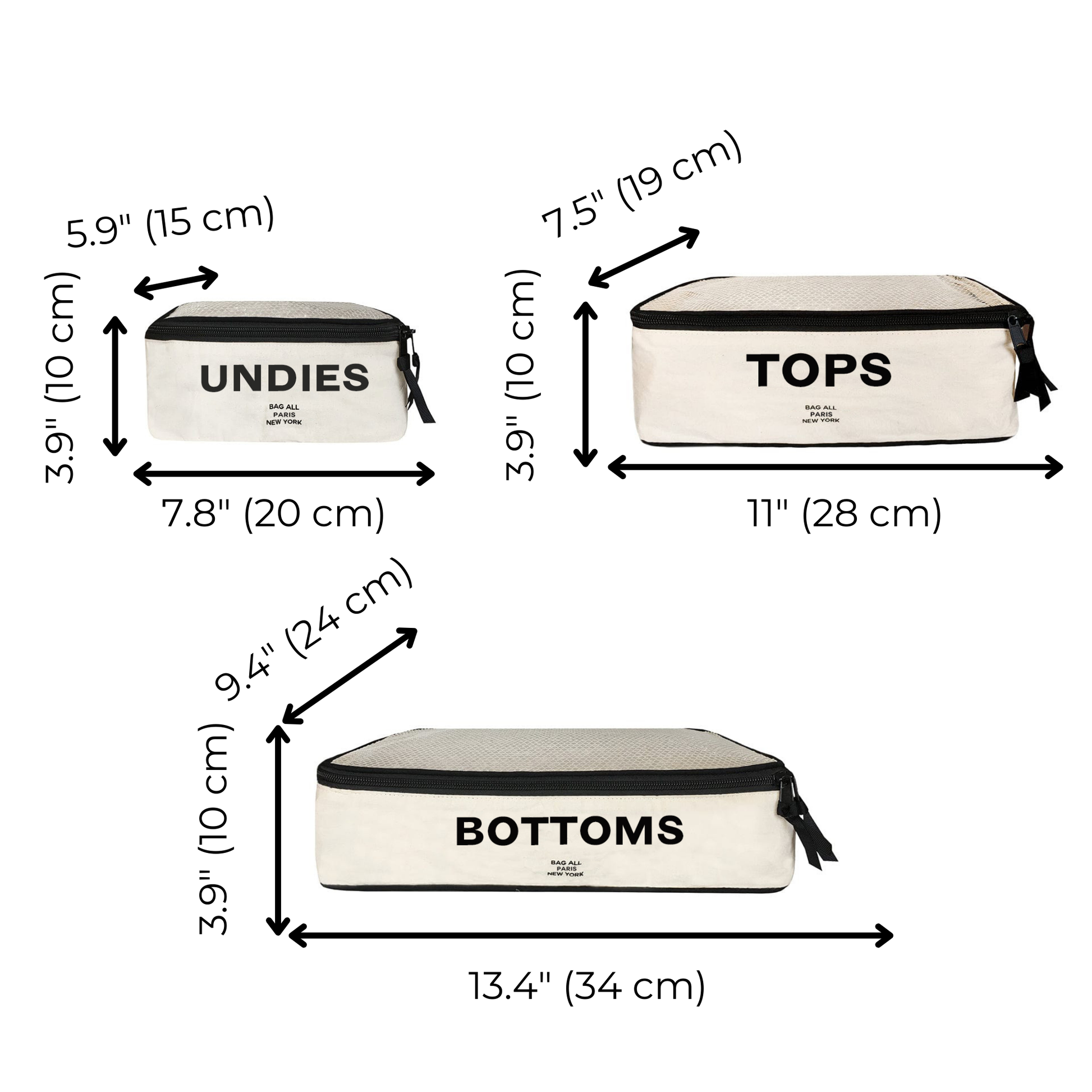 Bag-all Cotton Packing Cubes 3-pack in cream with labeled compartments for Undies, Tops, and Bottoms. Sizes displayed with measurements in inches and centimeters. Black zipper details and text on cream fabric.