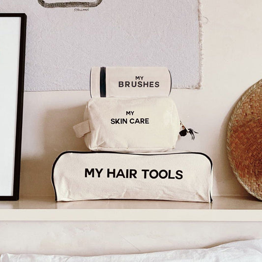 Bag-all Pamper Gift Set Deal 3-Pack Cream featuring natural cotton organizer cases for hair tools, brushes, and skincare, stacked neatly on white shelf with minimalist design text labels