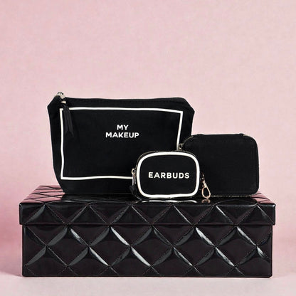 Black Bag-all handbag organizer trio with makeup, trinket, and earbud cases stacked on black textured box