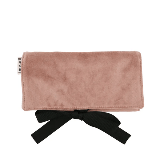 Pink eco velvet jewelry case with black ribbon tie, compact travel organizer by Bag-all on white background