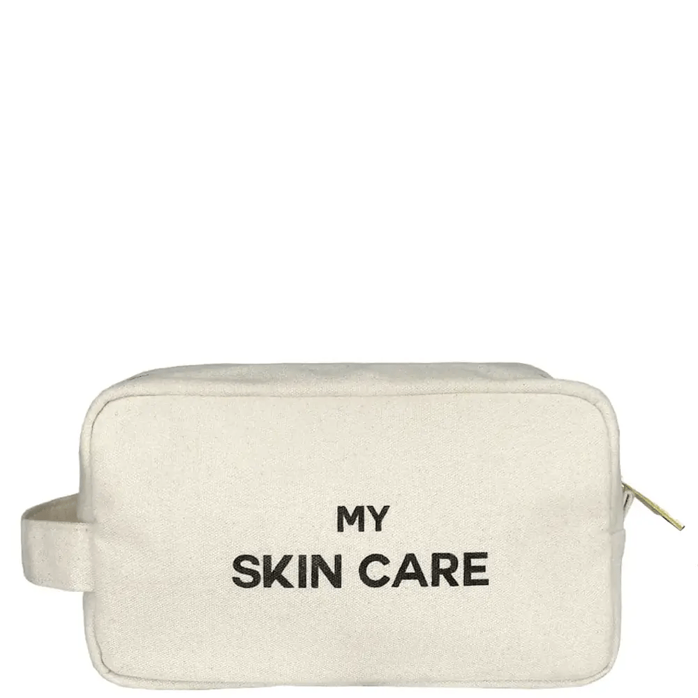 Bag-all My Skin Care Organizing Pouch in cream cotton canvas with waterproof lining, featuring black text and side handle for skincare storage and travel