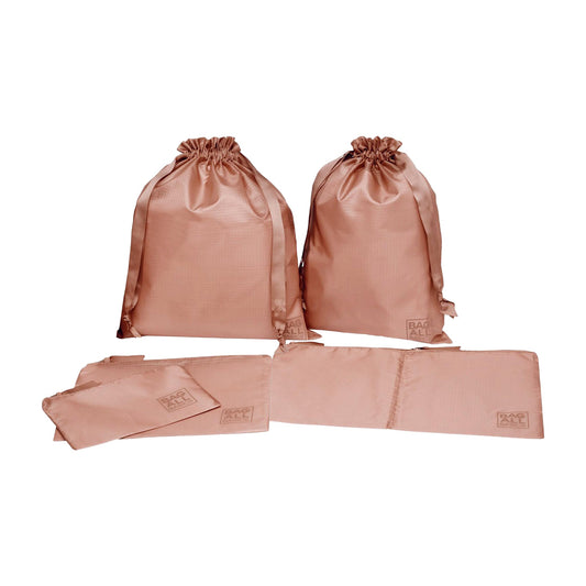 Bag-all recycled nylon packing bags set in pink/blush featuring 5 organizer bags in various sizes for travel, made from repurposed plastic bottles, with drawstring closures