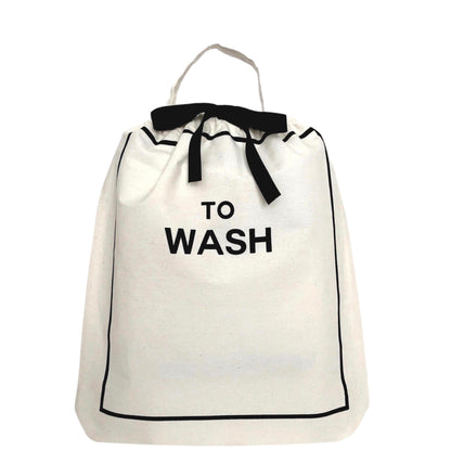 Bag-all To Wash Laundry Bag in cream with black trim, drawstring closure and carry handle, featuring bold 'TO WASH' text print, perfect for organizing dirty clothes while traveling