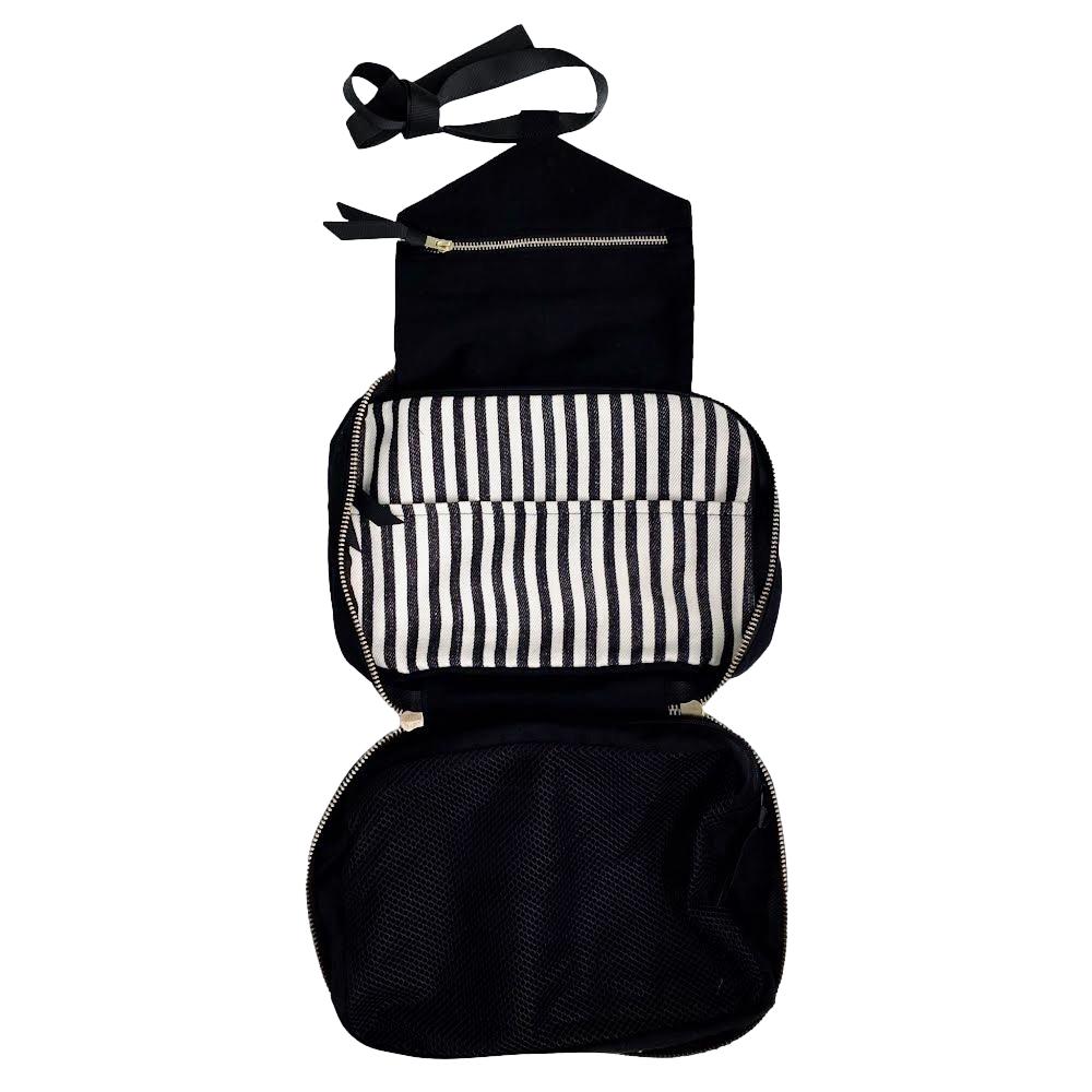 Bag-all Folding/Hanging Toiletry Case in black cotton with striped interior compartments, featuring multiple storage sections and adjustable hanging strap for travel organization