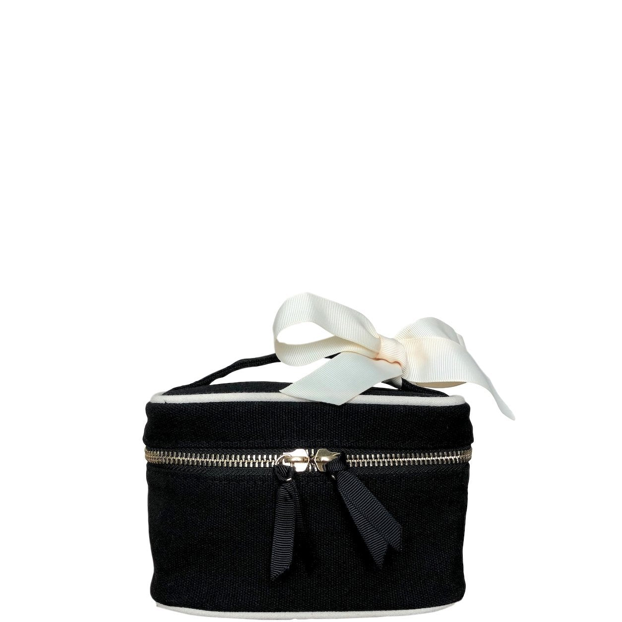 Mini boîte de beauté noire avec des détails blancs et un nœud blanc attaché à la poignée.