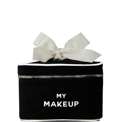 Bag-all My Makeup Cosmetic Box in black canvas with white bow, silver zipper and waterproof interior, perfect for organizing beauty essentials and travel