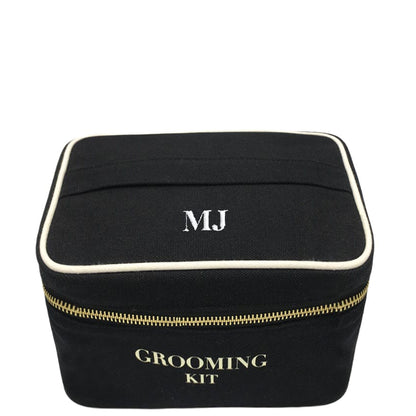 Bag-all Grooming Kit Box in black cotton with white trim and gold zipper, featuring monogram MJ and classic text, perfect for organizing toiletries and travel essentials