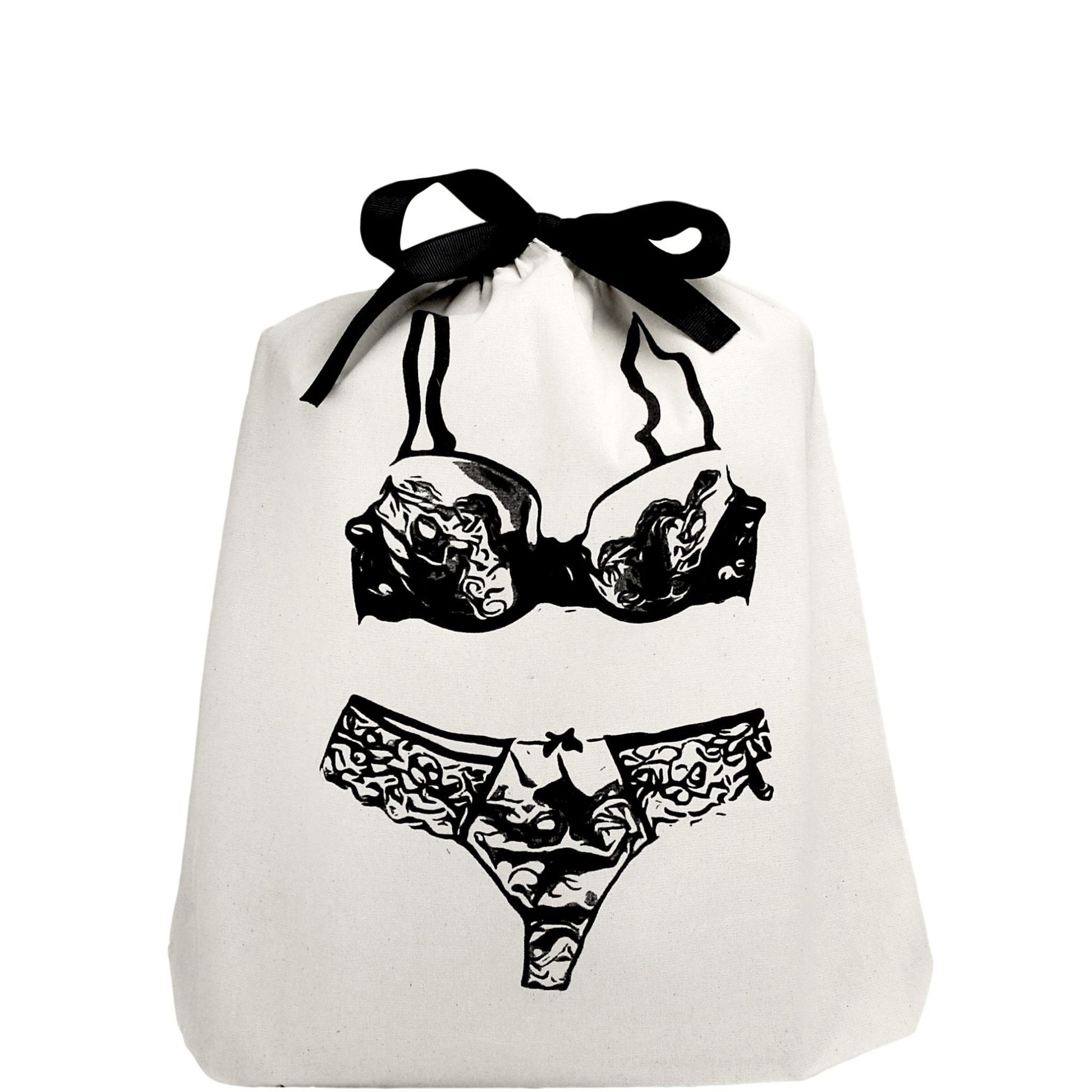 Sac de voyage avec lingerie en dentelle imprimée sur le devant.