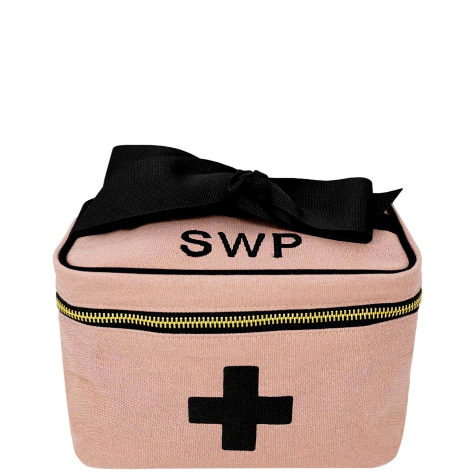 Bag-all Meds and First Aid Storage Box in blush pink cotton with black cross print, monogrammed SWP, featuring black bow and zippered closure