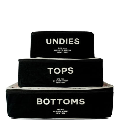 Bag-all Cotton Packing Cubes 3-pack in Black with white mesh top, featuring UNDIES, TOPS, BOTTOMS text print - organized travel storage solution with breathable design